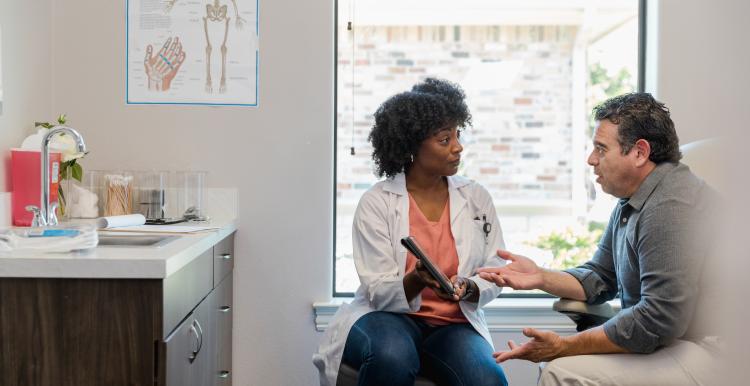 A doctor with a patient in a consulting room