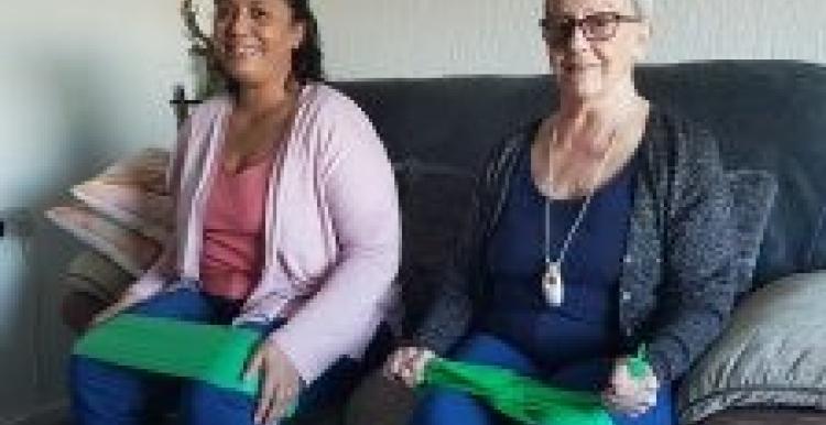 Julie (left) and Susie (right) exercising with resistance bands