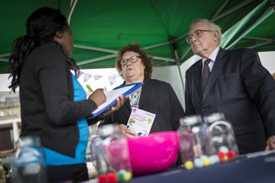 People speaking to a member of Healthwatch staff at a Healthwatch stall People speaking to a member of Healthwatch staff at a Healthwatch stall
